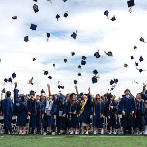 The 423 members of the Malden High Class of 2024 toss their caps in traditional fashion.