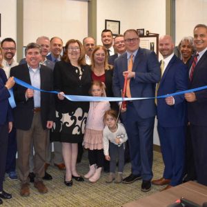 Members of the Chamber of Commerce, Mayor Carlo DeMaria’s office and the Baystate Financial team cut the ribbon to success.