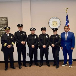 Pictured from left to right: Police Chief Paul Strong, Officers Elliot Bedoya, Dennis Arias, Tony Eason and Christianna Carroll and Mayor Carlo DeMaria.