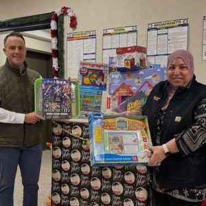 Mayor Patrick Keefe is shown with Revere Department of Engagement, Inclusion, and Culture Director Stephen Morabito, Revere Language Access Specialist Asmaa Abou-Fouda, DiDomenico Foundation Toy Drive Chairman Michael McLaughlin and some of the many toys collected to be distributed around Revere.