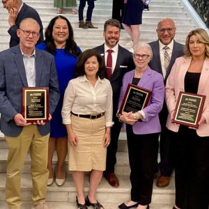 Senators Jason Lewis and Pavel Payano and Representatives Alice Peisch and Jessica Giannino along with Founder and CEO of Latinos for Education, Amanda Fernandez and other others from L4E.