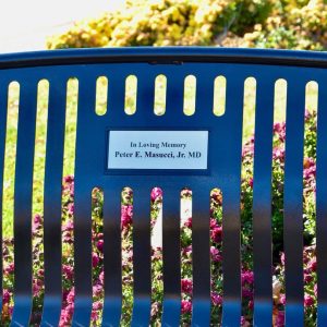 The new plaque on one of the benches at the 9/11 Memorial Park in front of Parlin Memorial Library.