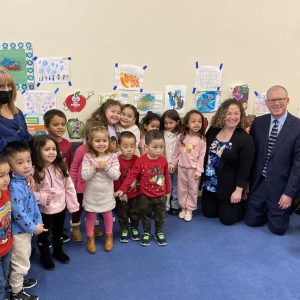 Senator Jason Lewis, Senator Becca Rausch, and Malden City Council President Steve Winslow along with an early education class of students and their teachers.