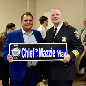 Mayor Carlo DeMaria presented a sign titled “Chief Mazzie Way” to Police Chief Steven A. Mazzie in celebration of his retirement.