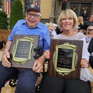 Last year “Person Of The Year” Award recipients Jack Klecker and Gail Cassarino displayed the plaques they received in the main event that captures the civic pride and spirit of Founder’s Day. At noon tomorrow (Saturday, Sept. 14), during a brief ceremony near the entrance of Saugus Town Hall, two citizens – a man and a woman – will be honored. (Saugus Advocate file photo by Mark E. Vogler)