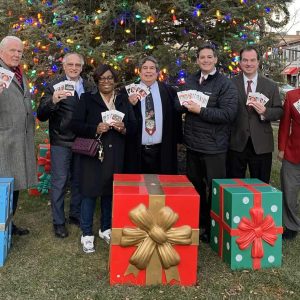 Pictured with some of the gift cards from left to right are Past President John Mackey, Past President and Past Lt. Governor John Mattuchio, Past President KathyAnn Dottin, Past President Roland Hughes, Current President Fred Capone, Past President Dave LaRovere, and Past President Pat Roberto.  (Courtesy photo)