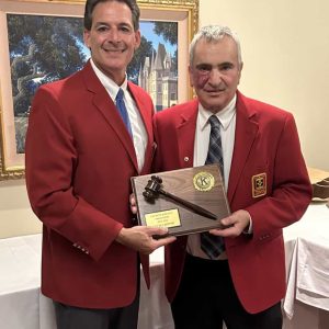 Outgoing president Fred Capone, left, is presented a plaque by President Pat Roberto during the club's recent installation ceremony in Malden.  (Courtesy photo)