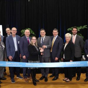 Pictured from left to right: State Representative Kate Lipper-Garabedian; State Representative/Massachusetts Legislature Joint Committee on Health Care Financing Chairperson John Lawn (rear); Representative Paul Donato; Massachusetts Department of Public Health Commissioner Dr. Robbie Goldstein (rear); State Senator Jason Lewis; Tufts Medical Center Psychiatrist-in-Chief and Department of Psychiatry Chairman Dr. Brent Forester, who is also Tufts Medicine’s Director of Behavioral Health and a professor and endowed Chair of Psychiatry; Ward 3 Councillor Amanda Linehan; Mayor Gary Christenson; Tufts Medicine President/CEO Michael Dandorph; Acadia Healthcare CEO Debbie Osteen; and Tufts Medicine Behavioral Health Hospital CEO Jameson Pinette.