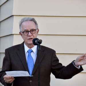 Everett Historical Commission Chairperson Lawrence Arinello speaking to attendees in front of First Congregational Church.