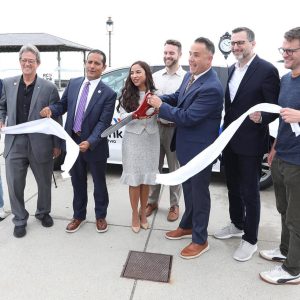 Historic Revere Beach was the scene of the ribbon cutting. Shown cutting the ribbon, from left to right: Revere Ward 2 Councillor Ira Novoselsky, Revere Councillor-at-Large Tony Zambuto, Chelsea City Manager Fidel Maltez, State Rep. Judith Garcia, Chelsea Director of Housing and Community Development Benjamin Cares, Revere Mayor Patrick Keefe, Via Senior Director of Partnerships Avi Ishofsky and Revere Chief of Planning and Community Development Tom Skwierawski.