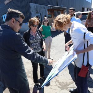 Project lead Marie Adams points out key changes to the area during Phase 1 of the River Works Project to Secretary Tepper and Mayor Christenson.