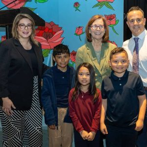 Mayor Patrick Keefe, State Rep. Jessica Giannino (left), author Pam Muñoz Ryan and A.C. Whelan Elementary School students are shown celebrating the school’s partnership with The U.S. of Readers, a Scholastic literacy program dedicated to providing books to Title I schools on Thursday.  (Courtesy photo)