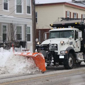 CLEAN UP: A City of Revere DPW snowplow is shown clearing the streets after the two-day storm winded down late Monday afternoon. (Advocate photo by Tara Vocino)