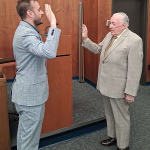WELCOME BACK: City Clerk Sergio Cornelio administered the oath of office to Councillor-at-Large John Hanlon on Monday night. The former mayor and former city councillor is filling the seat left by Wayne Matewsky, who recently resigned for health reasons. (Advocate photo)