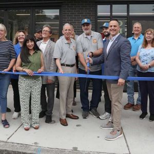 George and Hansi Vlladesi prepare to cut the ribbon to officially reopen the Bagel Bin on Shirley Avenue. Mayor Patrick Keefe, members of the Revere City Council and the Revere Chamber of Commerce, family and friends were on hand for the occasion.
