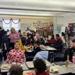 Students in Mrs. Knox’s class enjoy the Valentine’s Day Family Brunch.