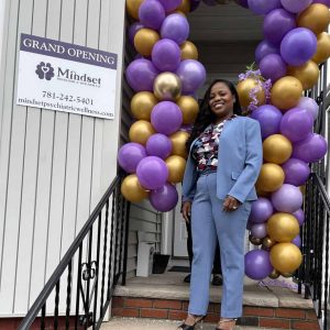 Dr. Rosemonde Paulo is shown at the entrance to Mindset Psychiatric & Wellness at 26 Ferry St. in Everett this past week.