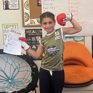 A.C. Whelan third grader Christopher Ball as fighting champ Oscar De La Hoya