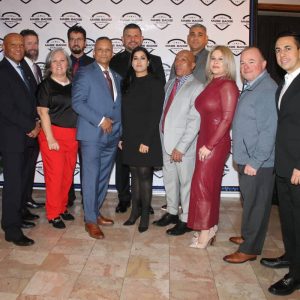 Shown from left: Michael Scaramozza, Marc Cardoso, Jeffrey DeDeo, Marcia Pretto, Fausto Pereira, Raoul Goncalves, Joseph Internicola, Nita Shiudat, Pedro Alves, Jose Amado, Edna DeDeo, Jeffrey McCabe and Domenic Licata.