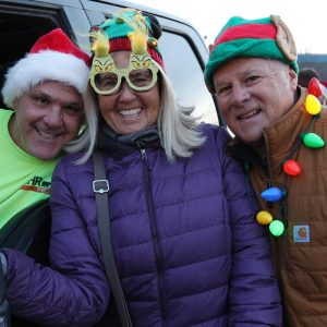 6.	Ray Nickerson joined Charlotte and Mark Ferrante for a photo before the Priscilla Nickerson Santa Walk started.