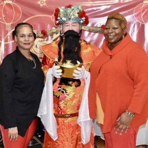 Pictured from left to right: Simone Holyfield, Hung Goon (dressed as an emperor) and Director of Diversity, Equity and Inclusion Cathy Draine.