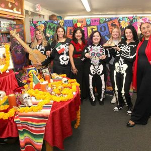 It’s the Day of the Dead – let’s celebrate: Asst. Librarian Lisa Ferrara, Revere Public Library Director Diana Luongo, Karina Liendo of Karina Travel Connection, Christina Puleo, Krystee Maniscalco, Kayla Quevillon and Esther Gomez.