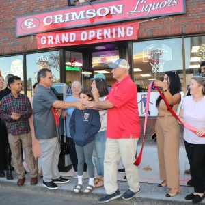 Mayor Carlo DeMaria congratulated owner Leonard Parsons following the ribbon cutting.
