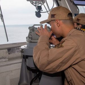 240723-N-UF592-1012 NAVAL AIR STATION NORTH ISLAND, Calif. (July 23, 2024) Lt. David Palencia, from Malden, Massachusetts, uses a telescopic alidade to gather positional data from the pilot house of the Nimitz-class aircraft carrier, USS Ronald Reagan (CVN 76), as it pulls into Naval Air Station North Island, California, July 23. As an integral part of U.S. Pacific Fleet, U.S. 3rd Fleet operates naval forces in the Indo-Pacific in addition to providing realistic and relevant training necessary to flawlessly execute our Navy’s timeless roles of sea control and power projection. U.S. 3rd Fleet works in close coordination with other numbered fleets to provide commanders with capable, ready forces to deploy forward and win in day-to-day competition, in crisis, and in conflict. (U.S. Navy photo by Mass Communication Specialist 2nd Class Eric Stanton)