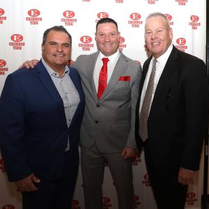 HAPPY RETURN: Mayor Carlo DeMaria and Superintendent of Everett Public Schools William Hart congratulate EHS Crimson Tide’s new Head Football Coach Rob DiLoreto during a press conference at Everett High School last Friday afternoon.  (Advocate photo)