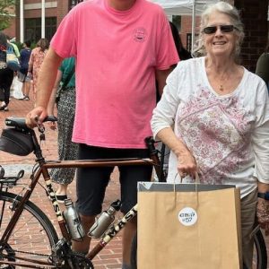 City Council President Steve Winslow and Helen Weitz enjoyed procuring artwork from the local artists.