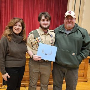 A FAMILY ACCOMPLISHMENT: Liam Martin’s parents were supportive and also involved in his 12 years in scouting, which culminated in his earning the Eagle Scout badge. Julie (left) and Robert (far right) joined their son at Tuesday night’s Board of Selectmen meeting when Liam received a Citation from selectmen. (Saugus Advocate photo by Mark E. Vogler)