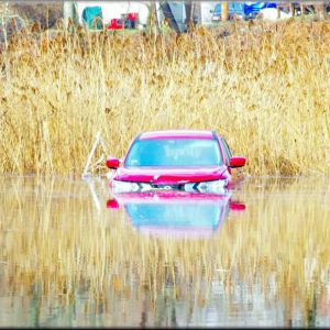 A FLOOD CASUALTY: This car parked behind the Hamilton Street Plaza was among the local property losses of last Saturday’s flooding. (Courtesy Photo to The Saugus Advocate by Charlie Zapolski)