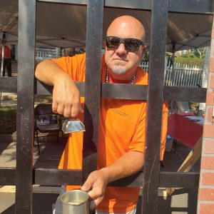 A JAIL BIRD FOR A CAUSE: Selectman Jeff Cicolini solicited donations from his makeshift jail cell at last year’s Founder’s Day, so he could help raise funds for the Saugus High School Band. (Saugus Advocate file photo by Mark E. Vogler)