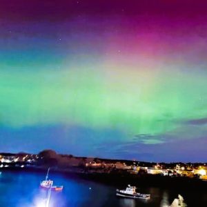 A NORTHERN LIGHTS SIGHT: Cheryl Walton Doucette and her husband Paul were enjoying a date night at Fox Hill Yacht Club when Cheryl noticed the aurora borealis from the deck overlooking the water. (Courtesy photo of Cheryl Doucette)