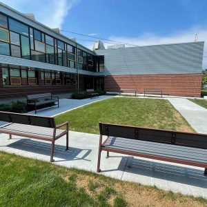 A REVAMPED COURTYARD: The recent completion of this project near the front entrance at the Belmonte STEAM Academy includes new benches, landscaping and the development of a stormwater management system to address drainage and flooding problems. (Courtesy photos to The Saugus Advocate)