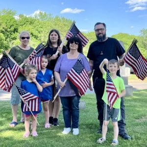 A SHOUT OUT FOR CEMETERY FLAGGERS: They were out in full force at Riverside Cemetery on May 24, decorating hundreds of veterans’ graves with new miniature flags. That flagging brigade included Rebecca Wise-Bono, Girl Scout Troop Leader of six troops, who was joined by two of her Scouts from Troop #83409 – McKenna Mahoney and Darla Spaulding. Mark Michaud and his children Ashlyn Michaud and Matthew Michaud and our Selectman Corinne Riley also joined in the flagging of graves. Everyone who participated took time from their busy afternoons to honor and remember our fallen Soldiers by placing flags on their graves in preparation for Memorial Day Ceremonies. Thank you. (Courtesy photo of Joanie Allbee)