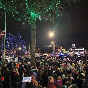 A SPECIAL NIGHT AT SAUGUS CENTER: This will be the view from the top steps of Saugus Town Hall tonight after Santa Claus flicks the light switch as the town hosts its Annual Tree Lighting Ceremony and Festivities. This photo shows the large crowd that gathered for last year’s event. (Saugus Advocate file photo by Mark E. Vogler)