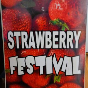 A SWEET SIGN OF SUMMER: This sign will mark the Strawberry Festival event this Saturday — with old-fashioned strawberry shortcakes in the American Legion Hall. In addition, there will be a Garden Club plant sale, crafters and other vendors on the Roby School lawn beside Main Street. (Courtesy photo of Laura Eisener)