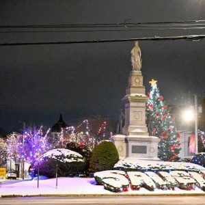 A WHITE LETTERING NIGHT: The light dusting of snow Dec. 28 accentuated the town’s name in shrubbery shapes in Saugus Center. (Photo courtesy of Laura Eisener)