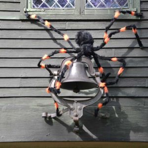 A giant spider scrambles up the bell at the Saugus Iron Works National Historic Site. (Courtesy photo to The Saugus Advocate by Laura Eisener)