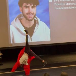 AFTER RECEIVING HIS SCHOLARSHIP AWARD, Elias Joseph Diaz does a cartwheel on stage at senior awards night (Courtesy photo of Teresa Tansey)