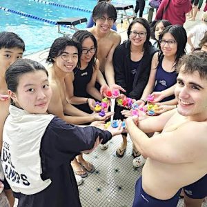 ALL-STAR SWIMMERS: The Malden High coed swim team included, from left to right, Joyce Zhou, Yinje Wang, Kevin Lin, Sophie Tran, Stanley Yip, Hailey Tran, Tiffany Pham, Gordon Zeng and Joao Santos. All of them except for Wang and Lin were announced as Greater Boston League All-Stars for this past season. (Courtesy Photo)