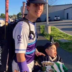 BROTHERLY LOVE: Aaron Connor, the starting catcher for Malden Catholic, is shown with his brother, Jared before the start of the Lancers game against Bishop Fenwick last week. The team honored Jared with the #4 patch on the team’s uniform. (Courtesy Photo)