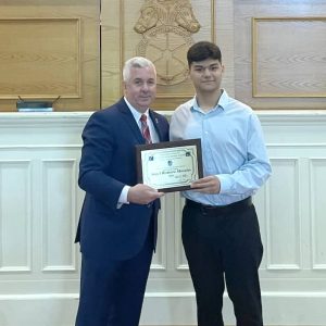 CONGRATULATIONS: Teamsters Local 25 President Tom Mari, left, presented a scholarship to Revere resident Angel Romero Morales during a recent ceremony.  (Courtesy photo)
