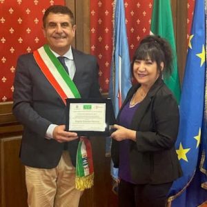 Ward 5 Councillor Angela Guarino-Sawaya is shown being presented a plaque commemorating her Ambassadorship by Mayor Giancarlo Ruggiero of the city of Mirabella Eclano in the province of Avellino, Campania, during her recent trip to her parents’ homeland. (Courtesy photo)