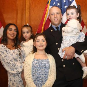 Firefighter Joshua Arsenault and family members, shown from left to right: proud wife Ashley, daughters Frankie, 4, Isabella, 8, and Wren, 1, and Firefighter Arsenault.