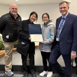 Malden High School (MHS) student Sophia Zhang (center) was presented an “Academic Excellence Award” from the MHS Art Department for her contribution to The Immigrant Learning Center’s Teen Perspectives on Immigration Contest. Presenting the award, from left, were MHS Principal Chris Mastrangelo, MHS art educator Gina Yu and Superintendent of Schools Timothy Sippel, Ed.L.D. (Courtesy/Malden Public Schools)