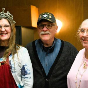 At last week’s Ahavas Sholom Sisterhood meeting, the focus was on the celebration of Purim, which was observed this year from sundown March 2 to sundown March 3. The holiday celebrates the rescue of the Jewish population from a planned mass murder in the Persian Empire in the 5th century BC, requested by Persian Prime minister Haman, but thwarted by Queen Esther, the Jewish wife of King Ahasuerus, just in time to save her community. At the Sisterhood meeting, one of the attendees is crowned annually as Queen Esther, and this year Joanie Allbee (wearing the tiara) was the choice. Seen with her is Bob Leroe, who spoke about a heroic female spy during World War II, and Maureen Appel, president of Congregation Ahavas Sholom. (Photo courtesy of Laura Eisener)