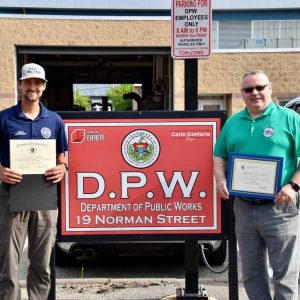 Assistant Water Superintendent Ralph Renzulli (left) and Water Superintendent Ernest Lariviere hold the Commonwealth of Massachusetts’ 2024 Public Water System Compliance award from the Massachusetts Department of Environmental Protection and a Governor’s citation. (Photo courtesy of the City of Everett)