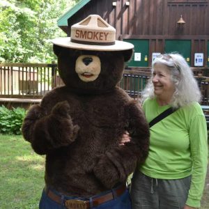 BEFRIENDED BY THE BEAR: Laura Eisener, author of the weekly “Saugus Gardens” column in The Saugus Advocate, recently hung out with Smokey the Bear at Breakheart Reservation. Smokey turned 80 on Aug. 9 and will be back at Breakheart next month to offer some fire safety tips. (Courtesy Photo to The Saugus Advocate)